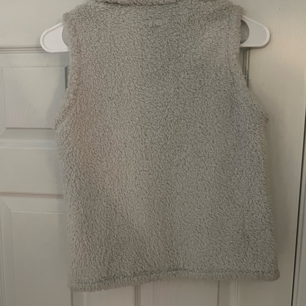 The North Face Girls Large light gray vest.